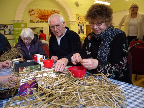 Winnie, Owen and Carol saving seeds for Seedy Saturday